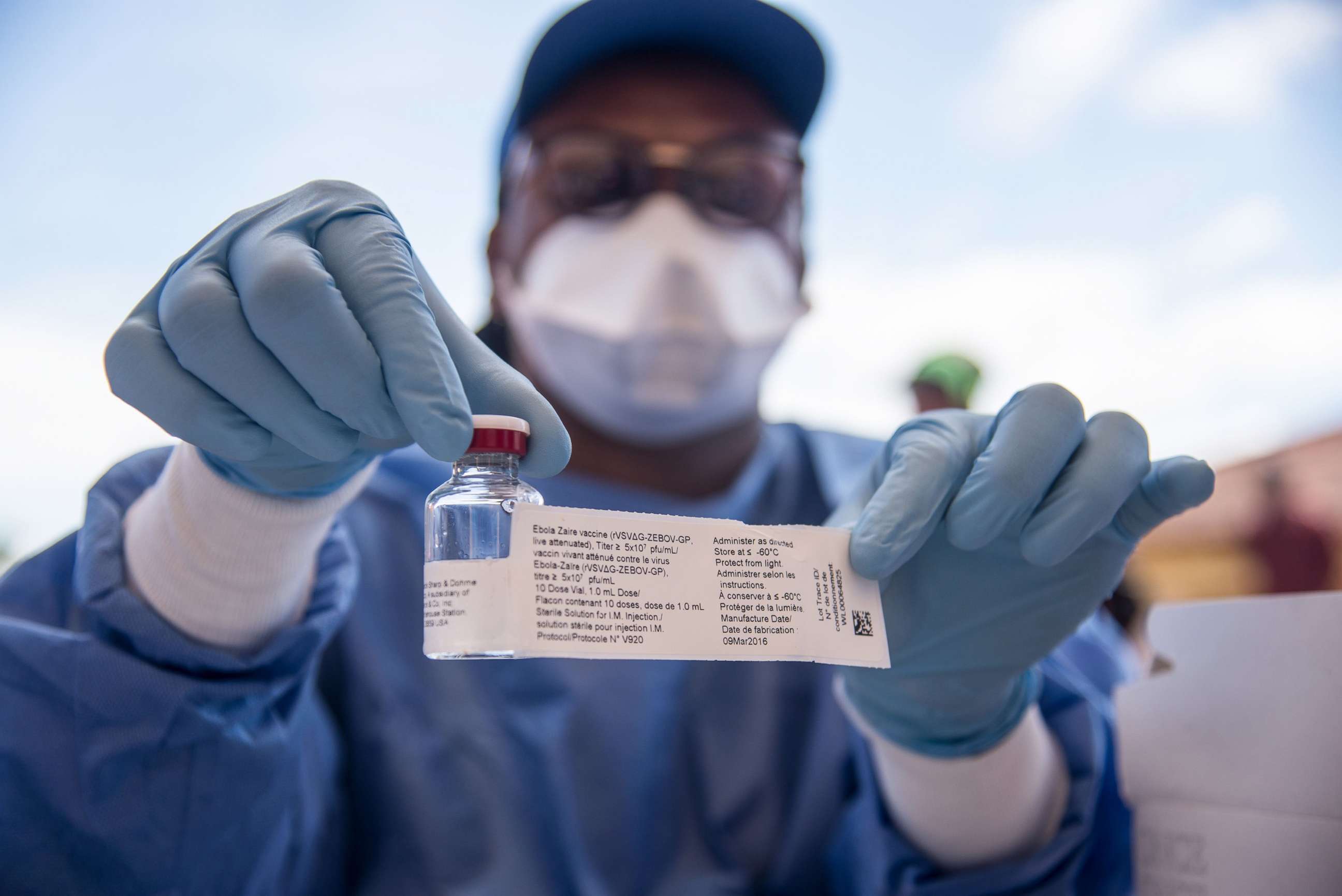 PHOTO: In this May 21, 2018, file photo, a nurse working with the World Health Organization (WHO) shows a bottle containing Ebola vaccine in the town of Mbandaka, Democratic Republic of Congo, during the launch of the Ebola vaccination campaign.