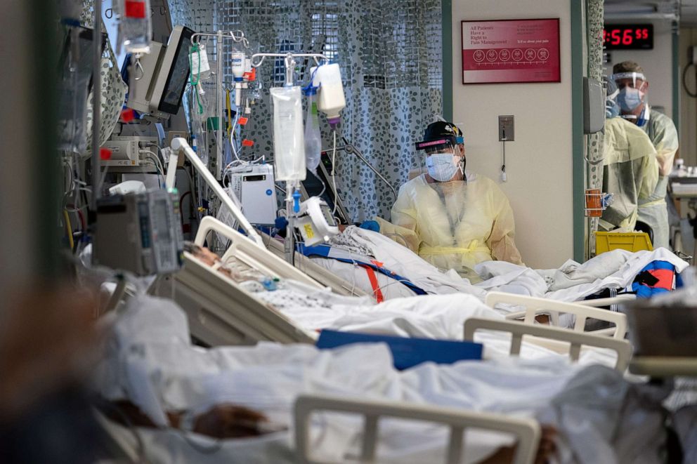 PHOTO: A hospital worker cares for a patients with the coronavirus at Elmhurst Hospital in Queens, May 8, 2020.