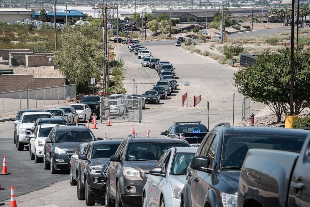 PHOTO: People wait in their cars at a mega drive-thru site at SISD Student Activities Complex on July 21, 2020, in El Paso, Texas.