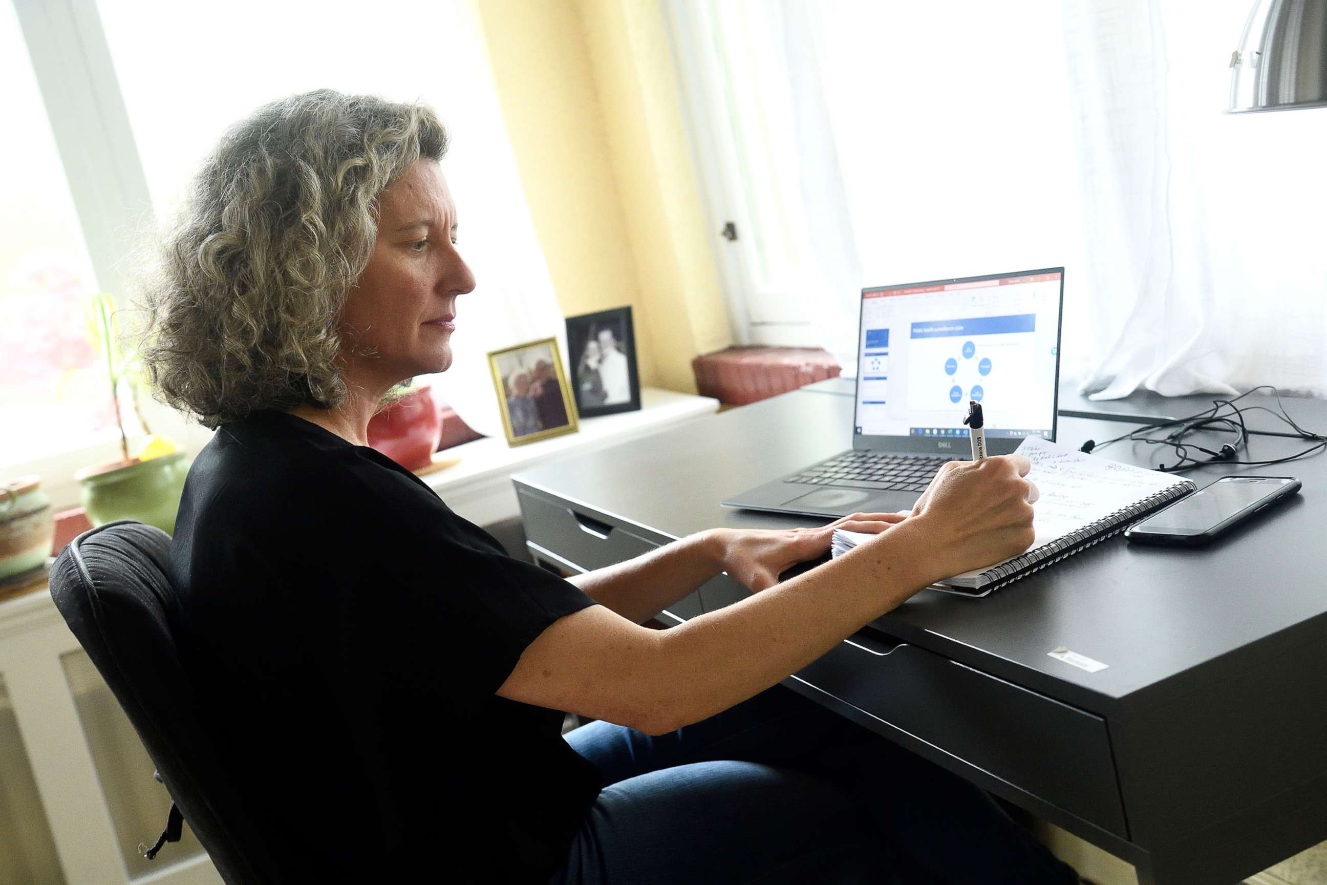 PHOTO: Epidemiology Professor Emily Gurley of the Bloomberg School of Public Health works from home during the Covid-19 pandemic shutdown. Dr. Gurley is training students and colleagues to do contact tracing work with the Baltimore City Health Department.