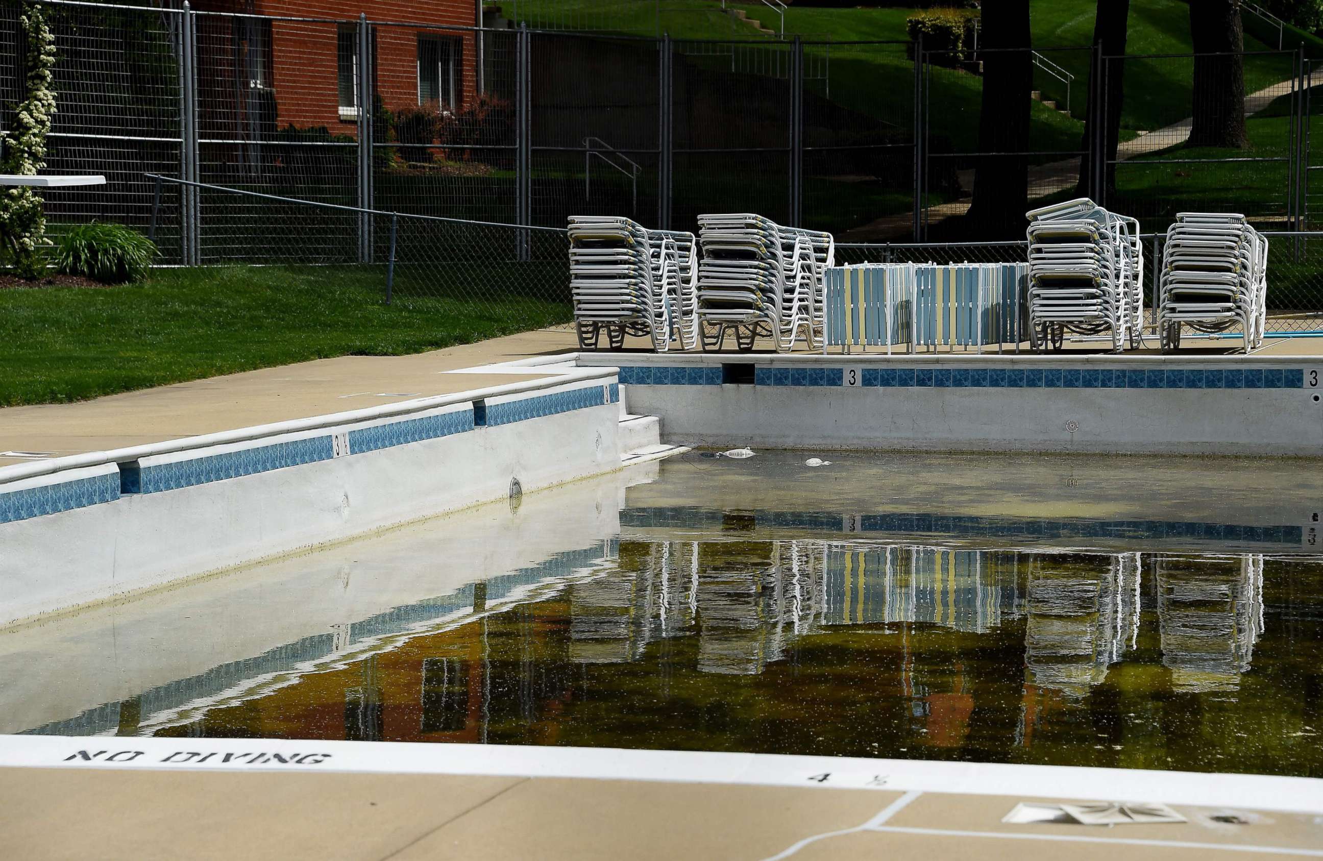 PHOTO: An empty pool is viewed at an apartment complex awaiting reopening as Memorial Day approaches amid the coronavirus pandemic, May 14, 2020, in Arlington, Virginia.