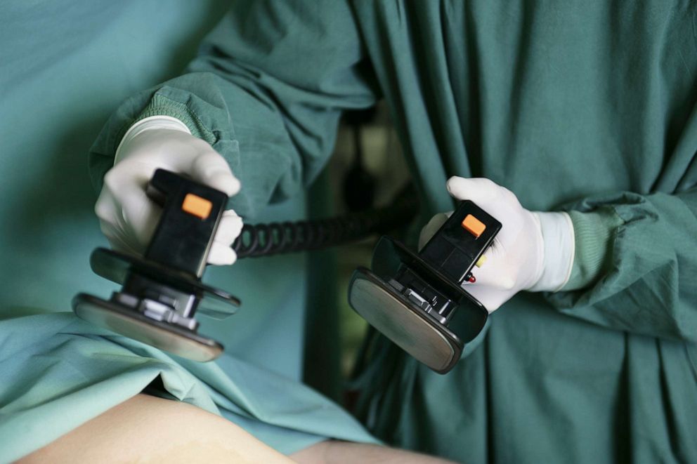 PHOTO: A doctor prepares to help a patient suffering cardiac arrest.