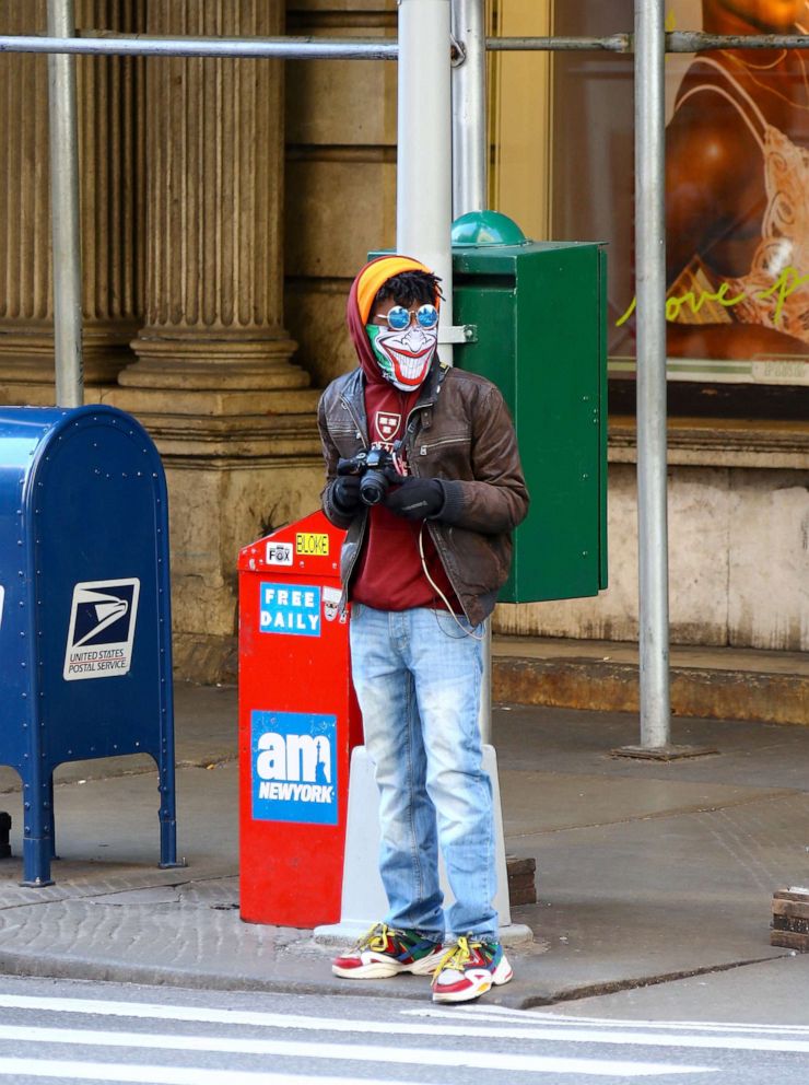 PHOTO: Man with Joker face mask is walking during the coronavirus pandemic in New York, April 1, 2020.