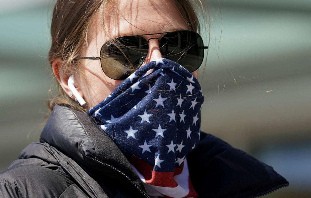PHOTO: A woman wears a stars and stripes bandana for a face mask, amid the coronavirus disease (COVID-19) fears, in Washington, April 2, 2020.