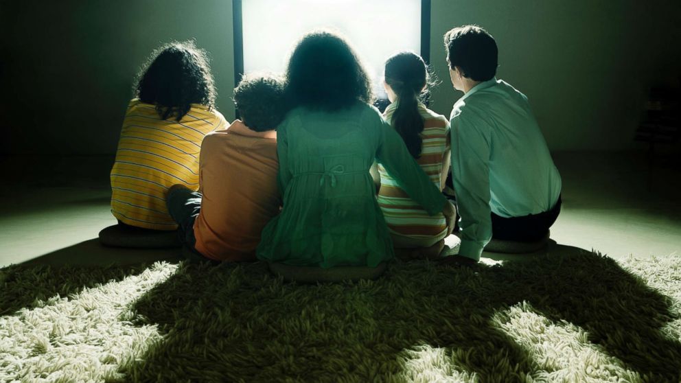 PHOTO: A family watch television together in this undated stock photo.