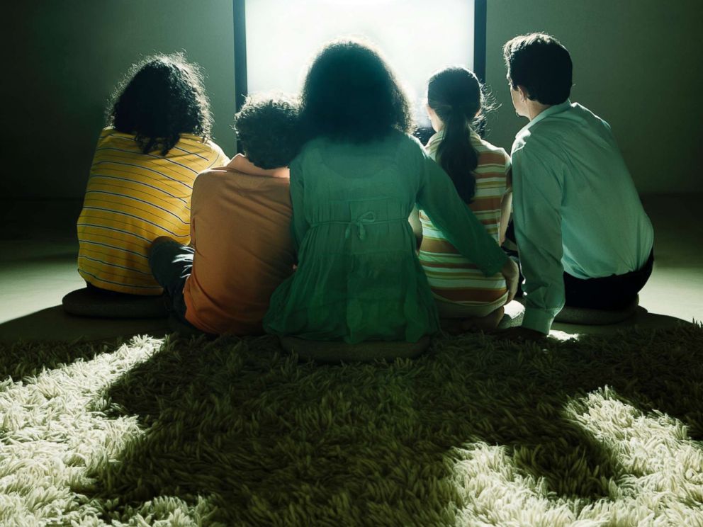 PHOTO: A family watch television together in this undated stock photo.