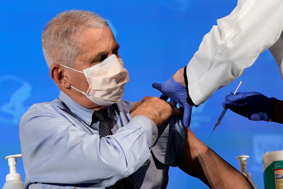 PHOTO: Dr. Anthony Fauci, director of the National Institute of Allergy and Infectious Diseases, prepares to receive his first dose of the new Moderna COVID-19 vaccine at the National Institutes of Health on Dec. 22, 2020.