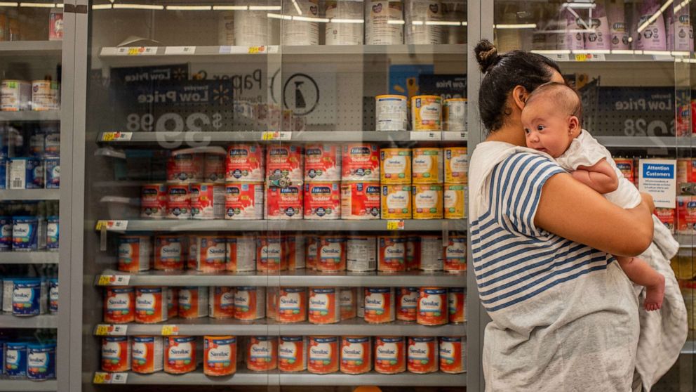 PHOTO: The Reyes family wait to receive baby formula as consumer goods continue seeing shortages as the country grapples with ongoing supply chain issues in Houston, July 08, 2022.