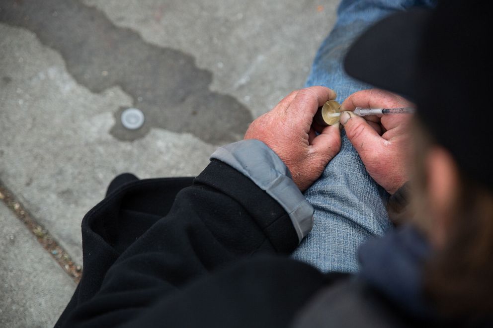 PHOTO: Seth Carus mixes fentanyl with water in a “cooker”
equipment often distributed at needle exchanges. 