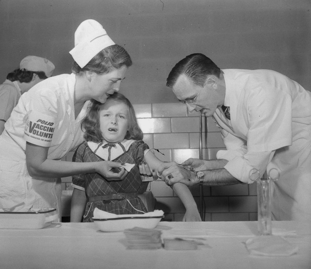 PHOTO: Dr. Richard Mulvaney inoculates seven-year-old Mimi Meade with the polio vaccine on April 26, 1954 in McClean, Va.  