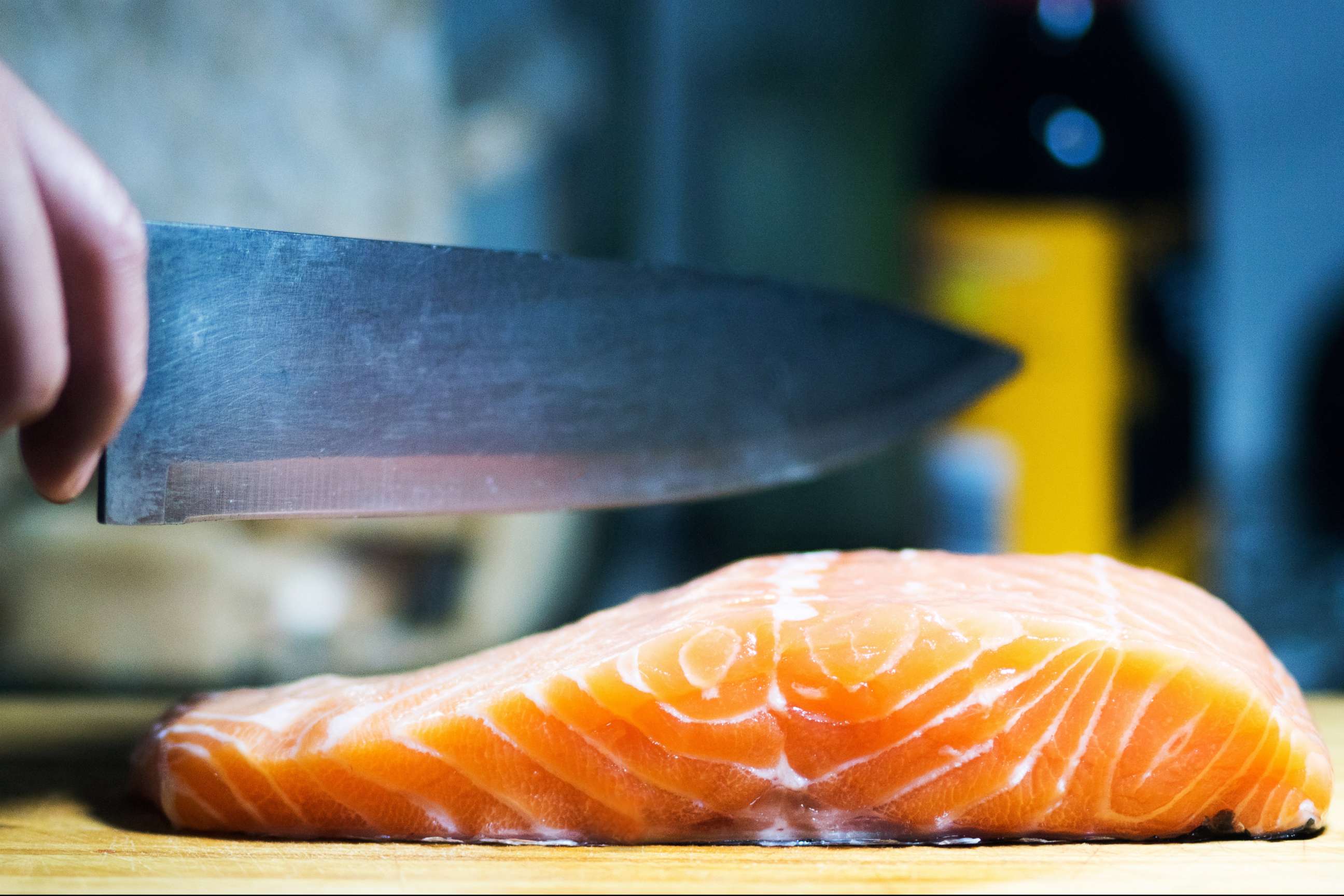 PHOTO: This stock photo depicts a chef preparing salmon.