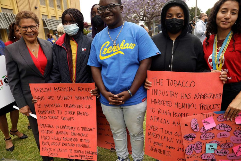 Rep. Karen Bass, left, a Los Angeles mayoral candidate, stands with Crenshaw High School students during a presser by the Black Leaders Against Tobacco Injustice Campaign to Protect California Kids at Crenshaw High School in Los Angeles, May 20, 2022.