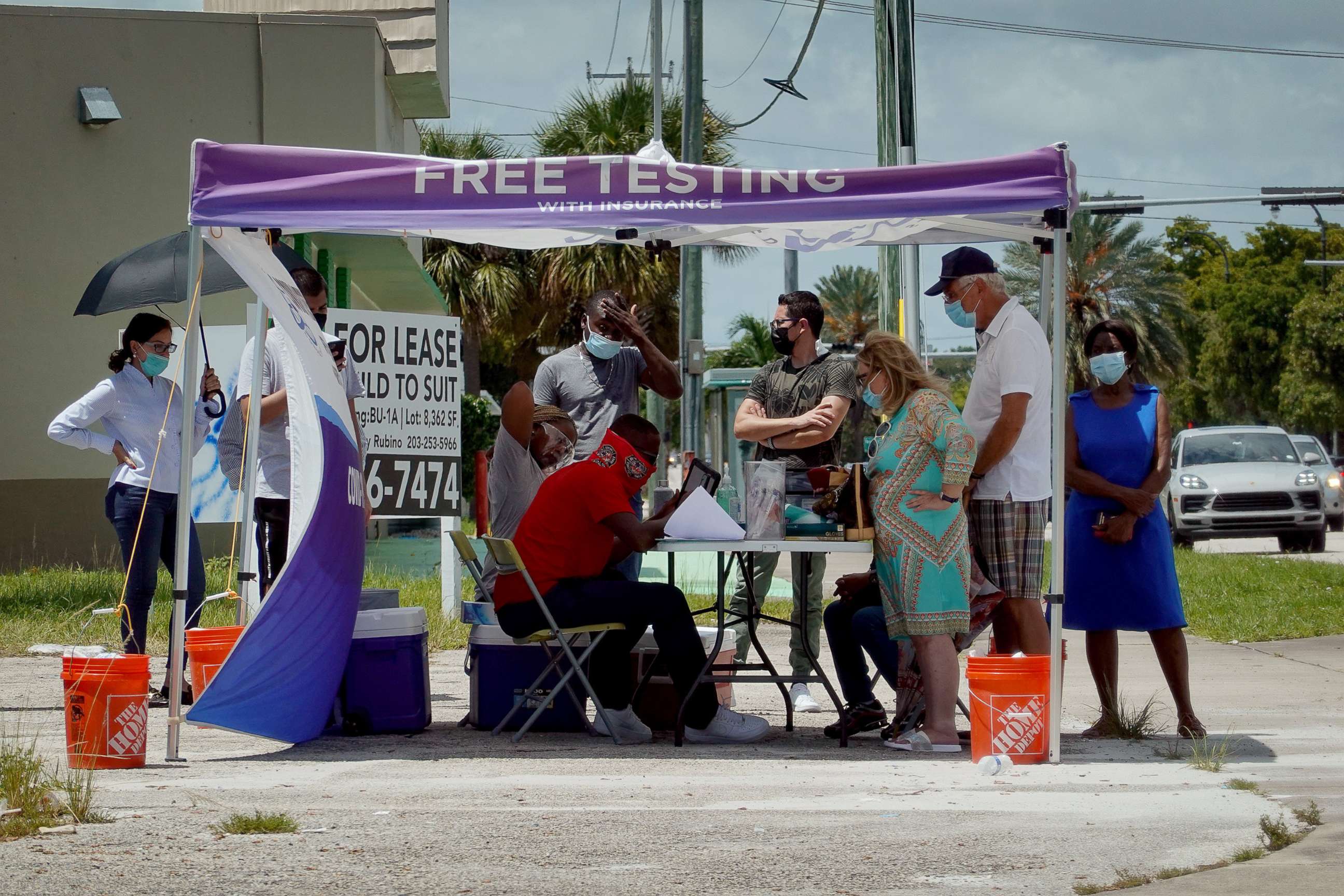 PHOTO: People wait to receive a COVID-19 test at a pop-up testing location on July 26, 2021 in Miami, Fla.