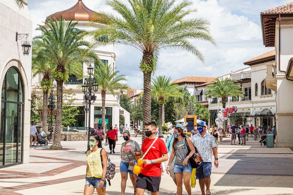 PHOTO: In this Sept. 27, 2020, file photo, people wear face masks at the Walt Disney World Resort in Orlando, Fla.
