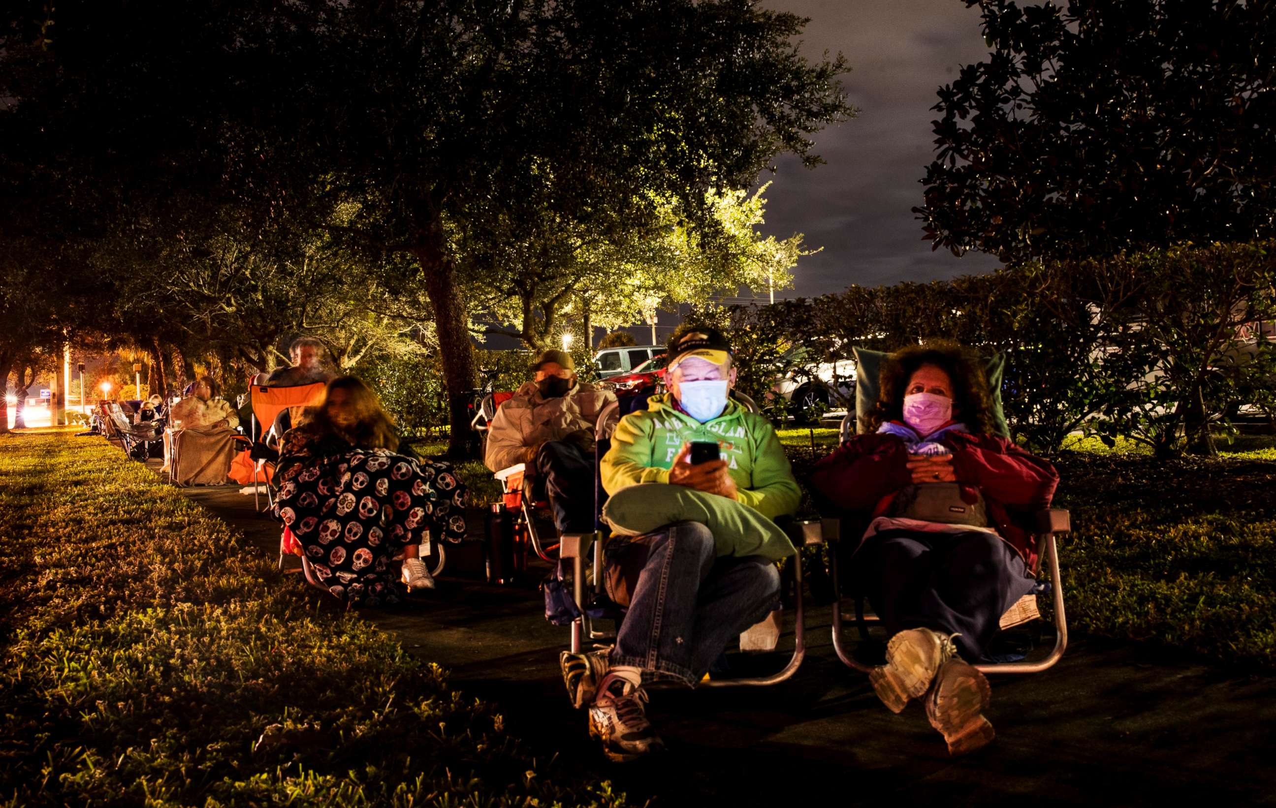 PHOTO: Tom and Judy Barrett from Marco Island wait in line in the early morning hours of  Dec. 30, 2020, at Lakes Park Regional Library in Fort Myers, Fla., to receive the COVID-19 vaccine.