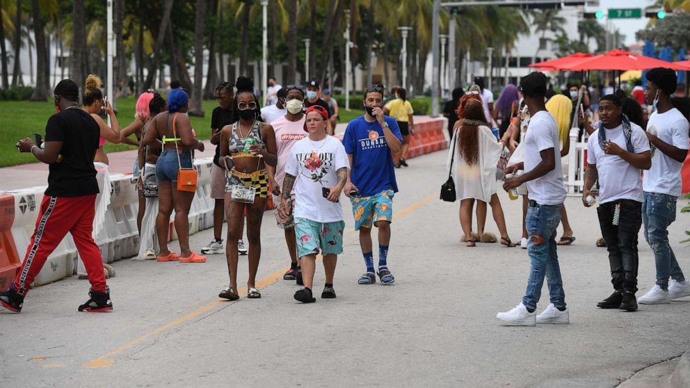 PHOTO: People walk along Ocean Drive in Miami Beach, Fla., on July 15, 2020.