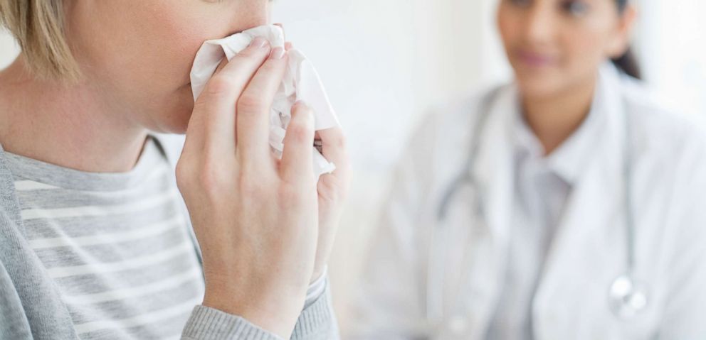 PHOTO: A woman blows her nose in this undated stock image.