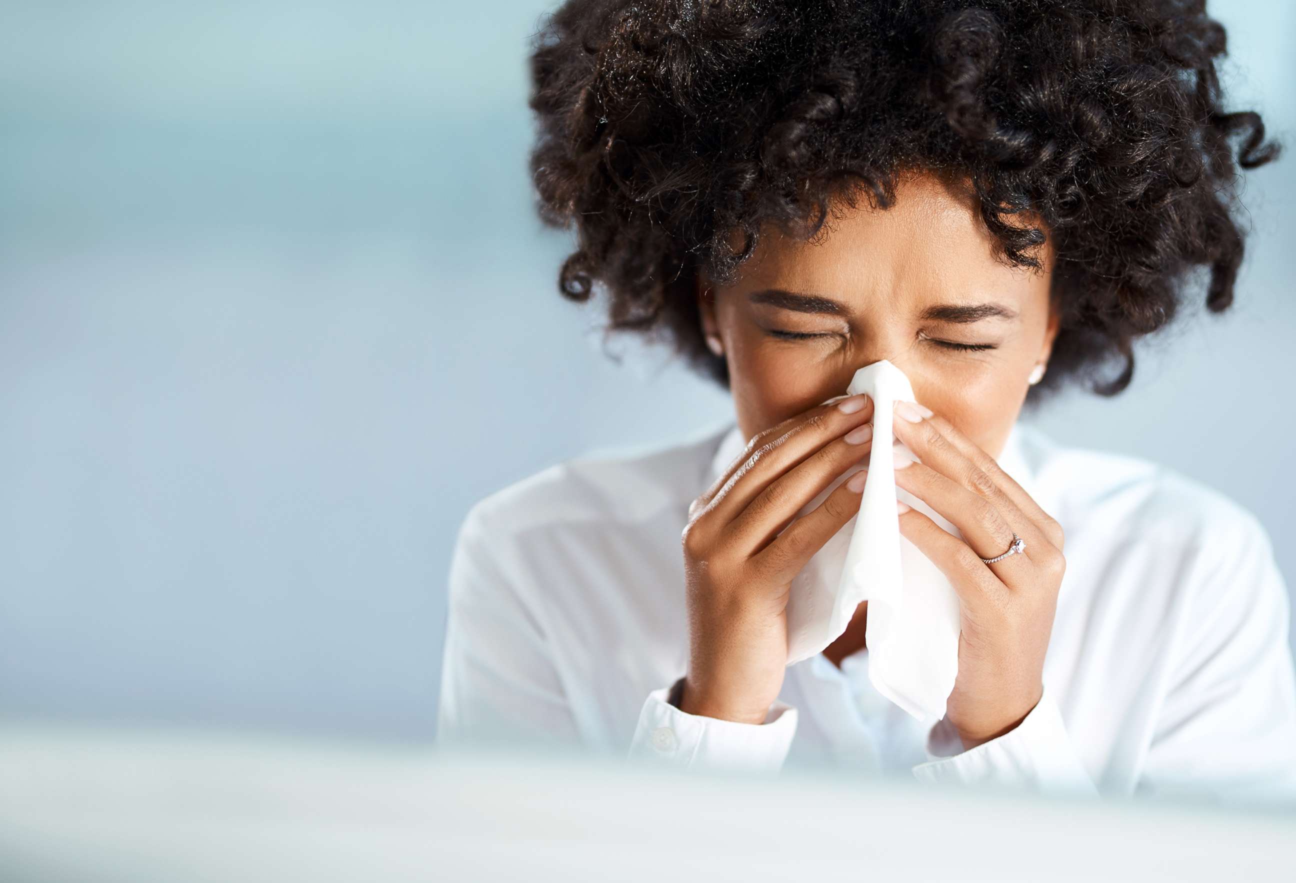 PHOTO: A woman blows her nose in this undated stock photo.