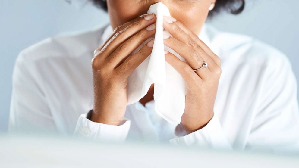 PHOTO: A woman blows her nose in this undated stock photo.