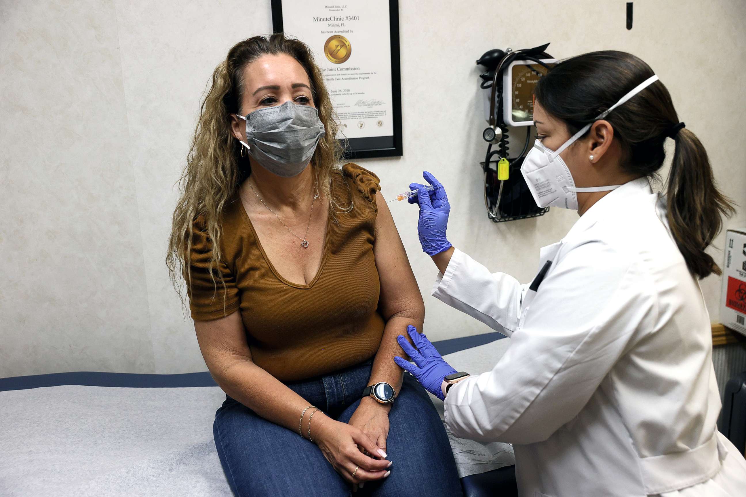 PHOTO: A nurse practitioner administers a flu vaccine to a patron at a CVS pharmacy and MinuteClinic, on Sept. 10, 2021 in Miami. CVS Health is offering the flu shots by appointment or walking in.