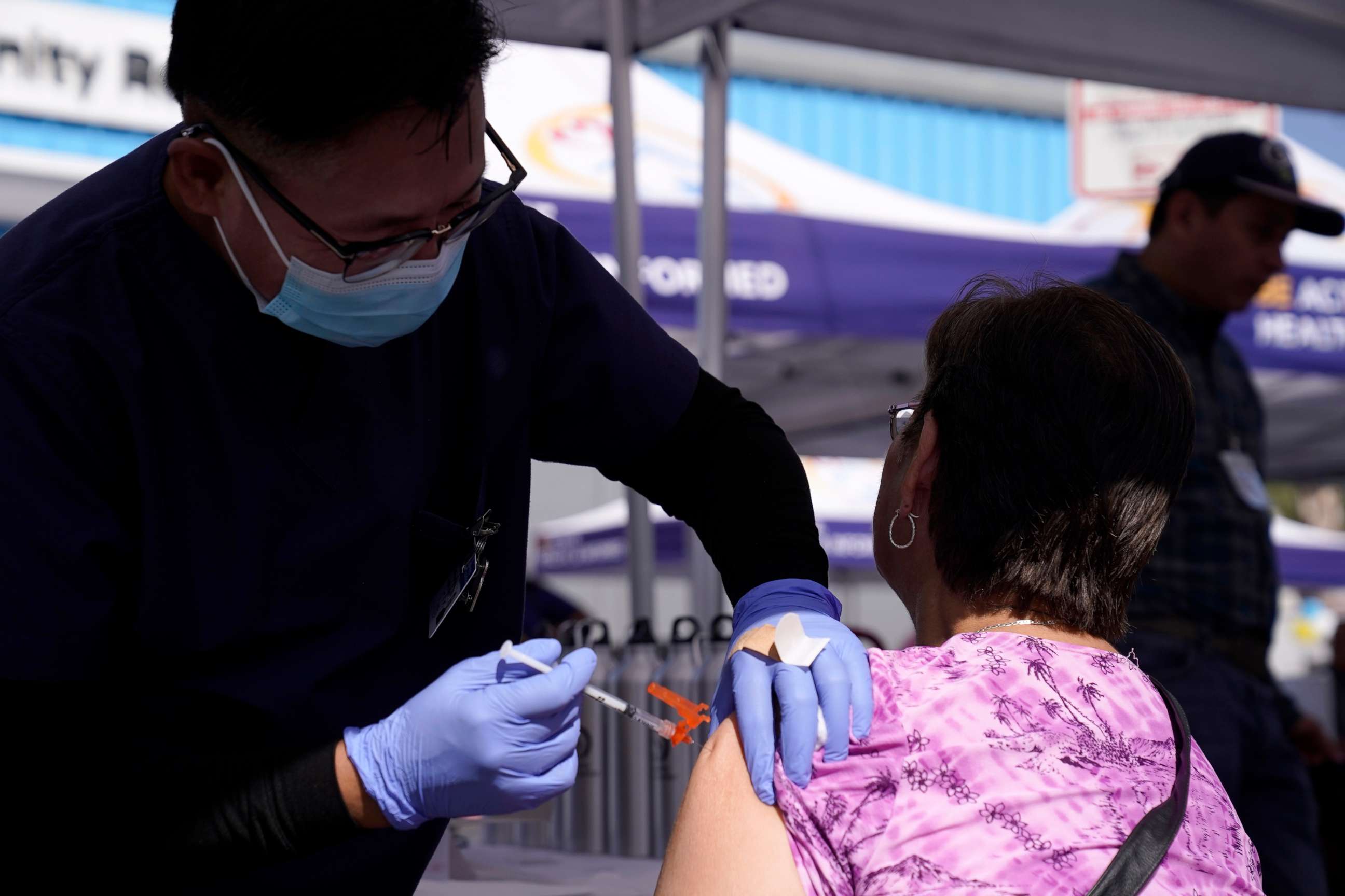 PHOTO: Maria Lopez is given a flu vaccine by nurse Gigi Urcia at the Blue Shield of California Promise Health Plans' Community Resource Center, Oct. 28, 2022, in Lakewood.