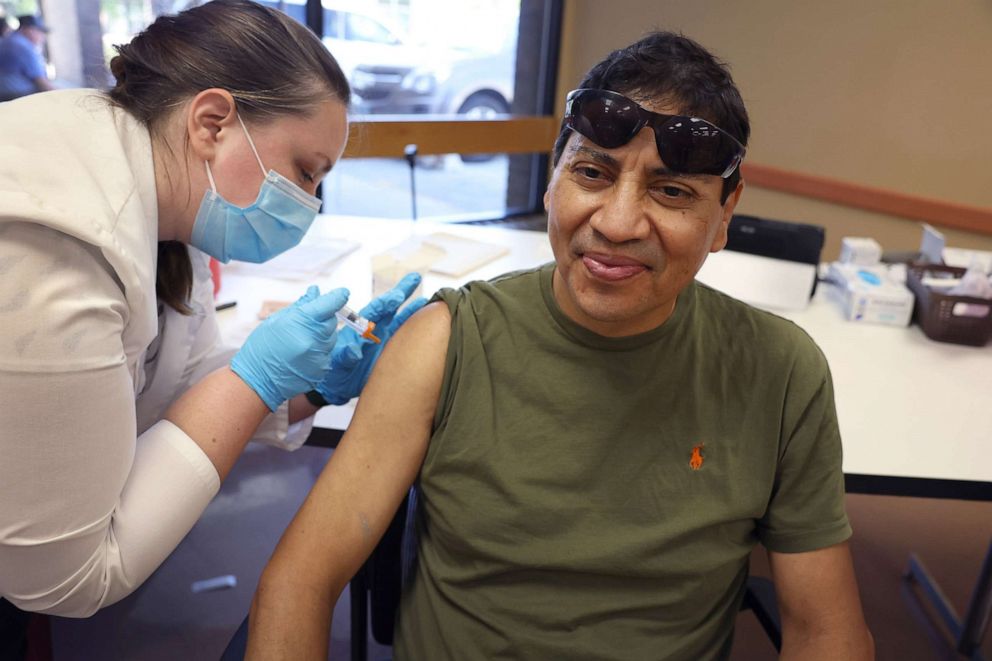 PHOTO: A person gets an  influenza vaccine from a pharmacist during an event hosted by the Chicago Department of Public Health at the Southwest Senior Center, on Sept. 9, 2022, in Chicago.