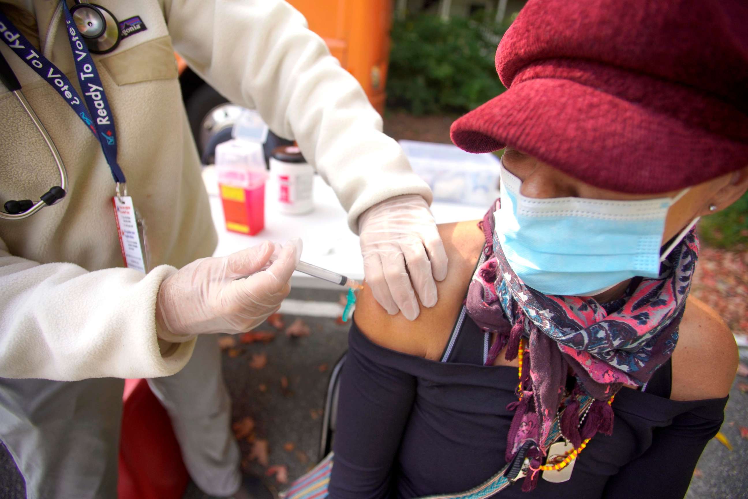 PHOTO: A patient receives a flu shot from a healthcare professional as The CHP (Community Health Program) Mobile Health Unit parked at South Street Congregational Church, Sept. 24, 2020, in Pittsfield, Mass.