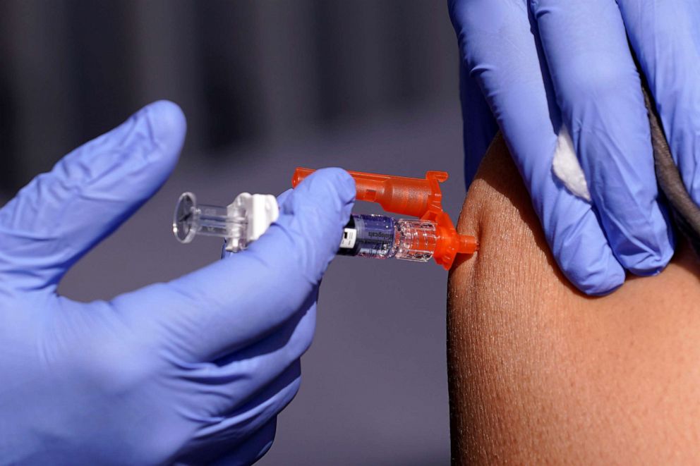 PHOTO: A patient receives a flu vaccine at the Community Resource Center of LA Care and Blue Shield of California Promise Health Plans, where they offered members and the public free flu and COVID-19 vaccines, October 28, 2022, in Lynwood, California 