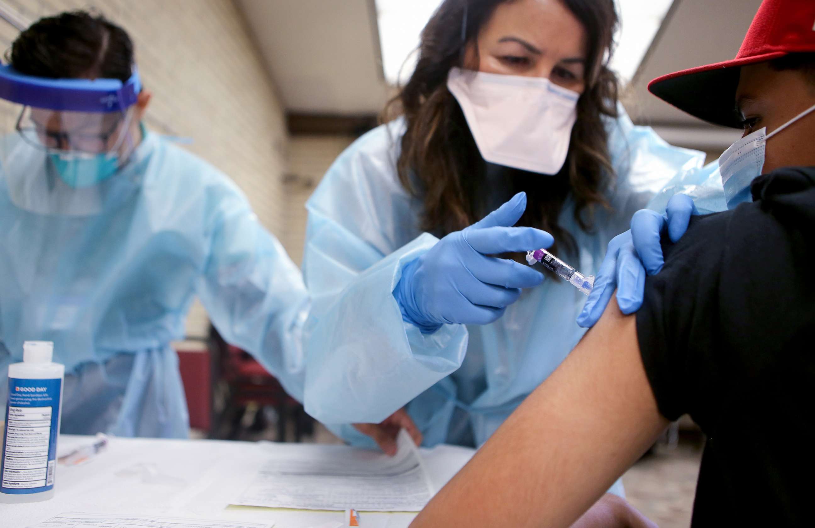 PHOTO: In this Oct. 14, 2020, file photo, a nurse gives a flu vaccination shot to a young man at a free clinic held at a local library in Lakewood, Calif.