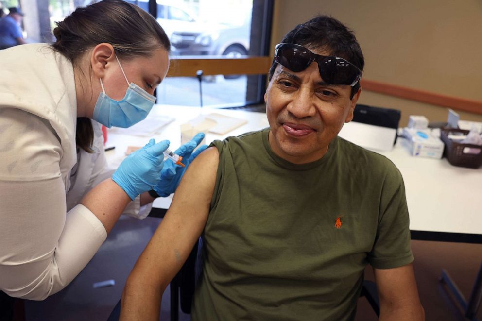 PHOTO: In this Sept. 9, 2022, file photo, a man gets an influenza vaccine from a pharmacist during an event hosted by the Chicago Department of Public Health at the Southwest Senior Center in Chicago.