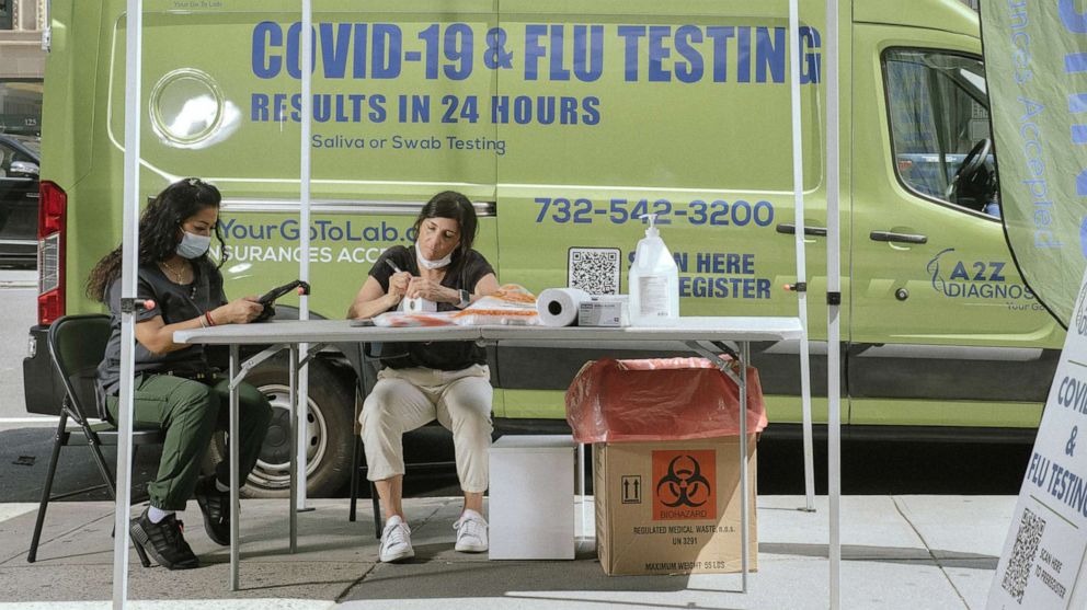 PHOTO: A mobile Covid-19 and flu screening site operates in New York, May 22, 2022.