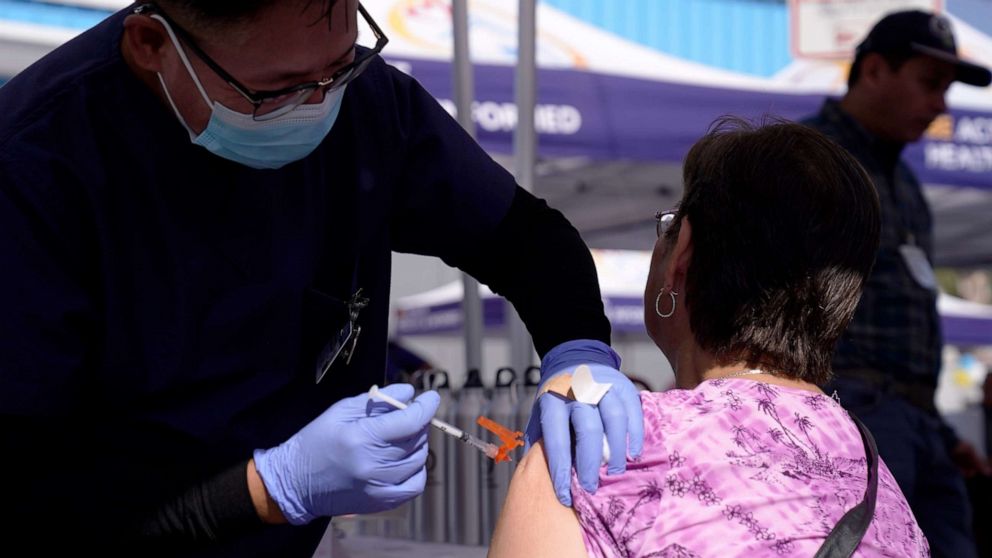 PHOTO: A woman is given a flu vaccine by a nurse at the L.A. Care and Blue Shield of California Promise Health Plans' Community Resource Center where they were offering members and the public free flu and COVID-19 vaccines, Oct. 28, 2022, Lynwood, Calif. 