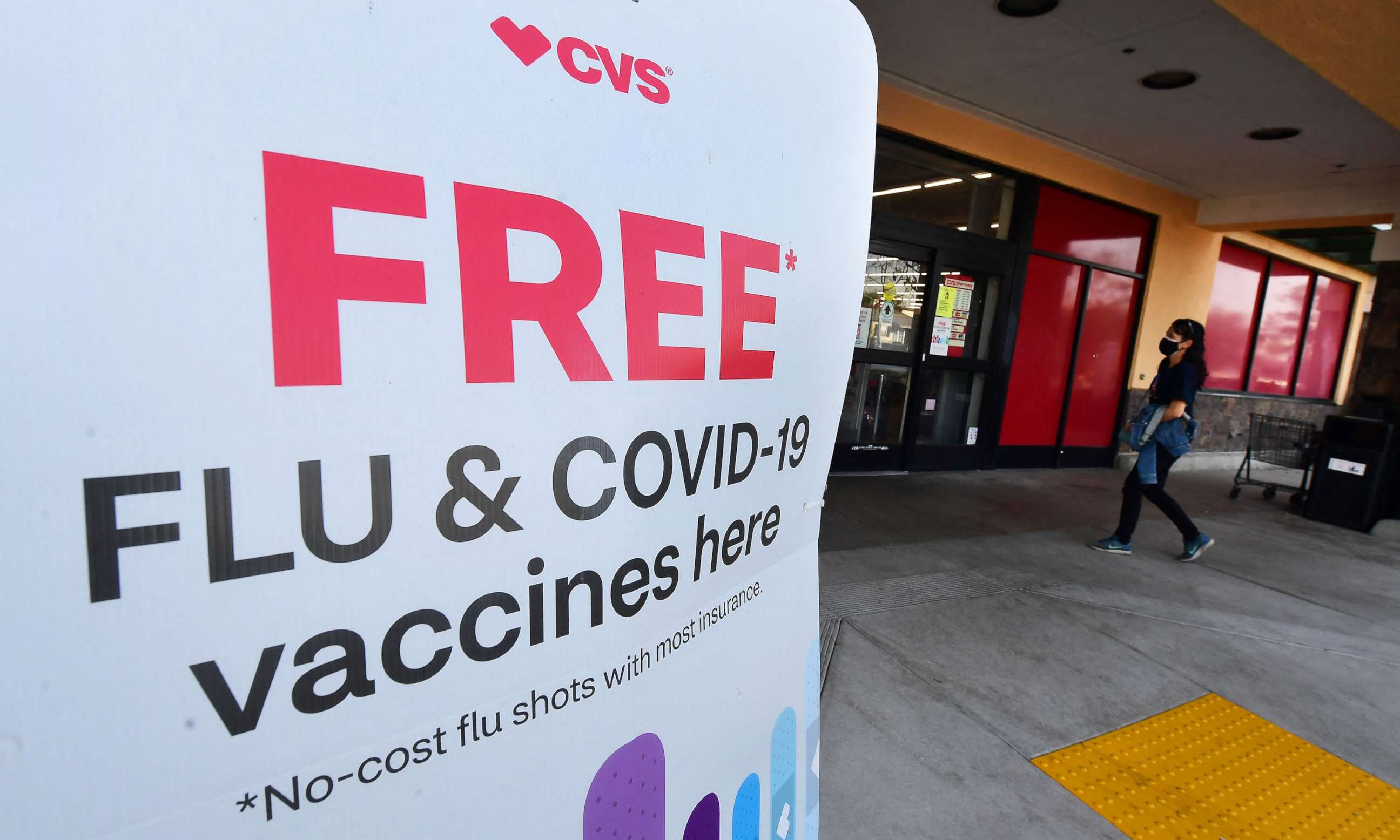 PHOTO: A sign announces free flu vaccines outside a CVS pharmacy, Jan. 14, 2022, in Monterey Park, Calif.