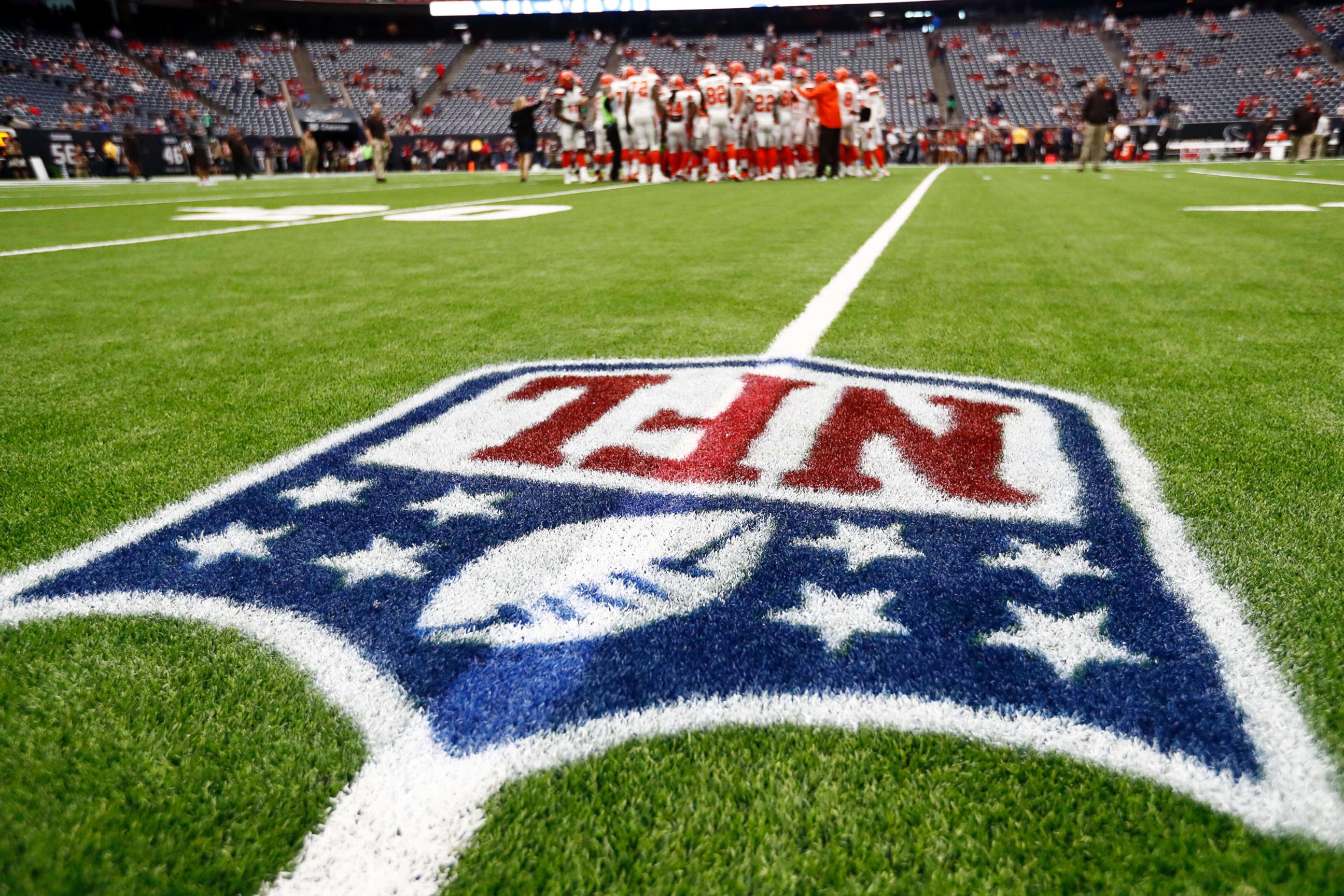 PHOTO: The NFL logo is shown as the Cleveland Browns huddle on the field before an NFL football game against the Houston Texans , Oct. 15, 2017, in Houston. 