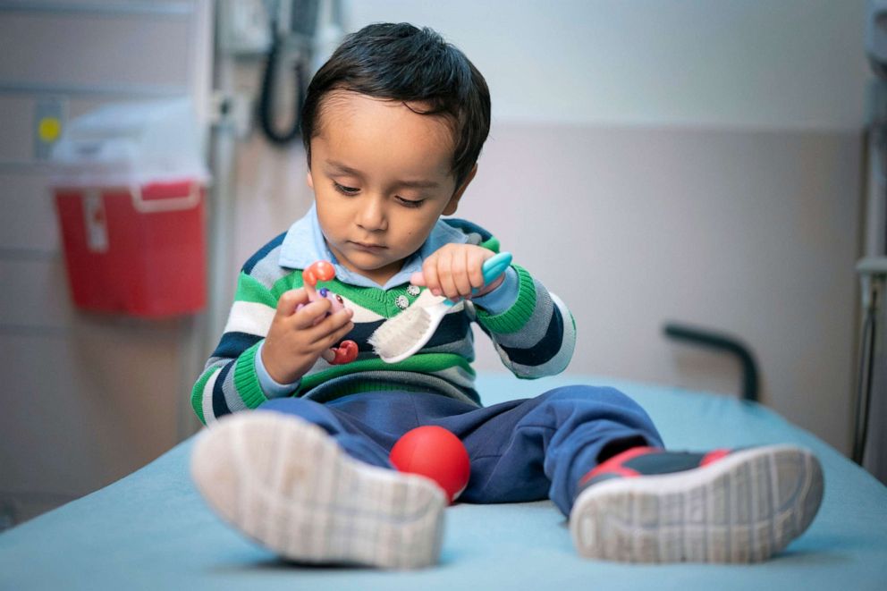 PHOTO: Gael Jesus Pino Alva, 2, plays with toys at a hospital in Memphis.