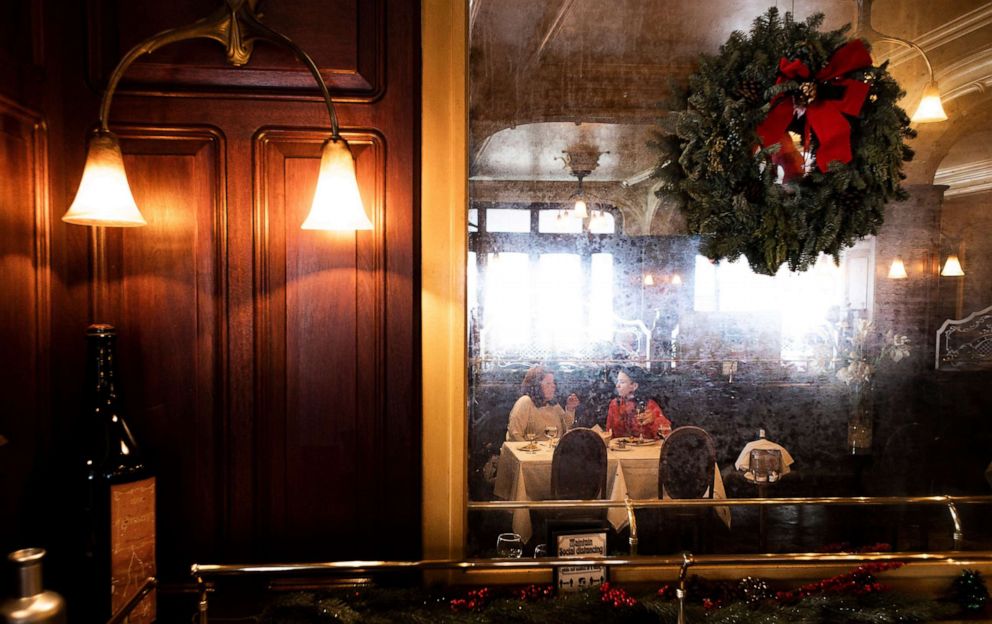 PHOTO: People eat at the restaurant Orsay during lunch time in New York, Dec. 11, 2020. New York Governor announced today that the city is suspending indoor dining in response to the city's high hospitalization rates and high rates of COVID-19.