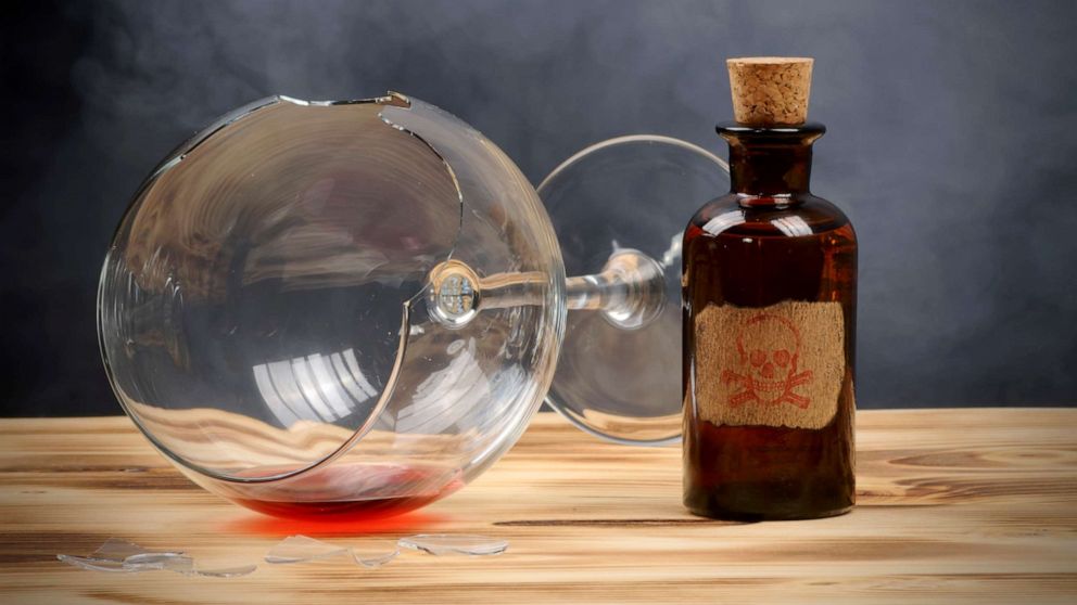 PHOTO: A broken wine glass and poison bottle are seen in this stock photo.