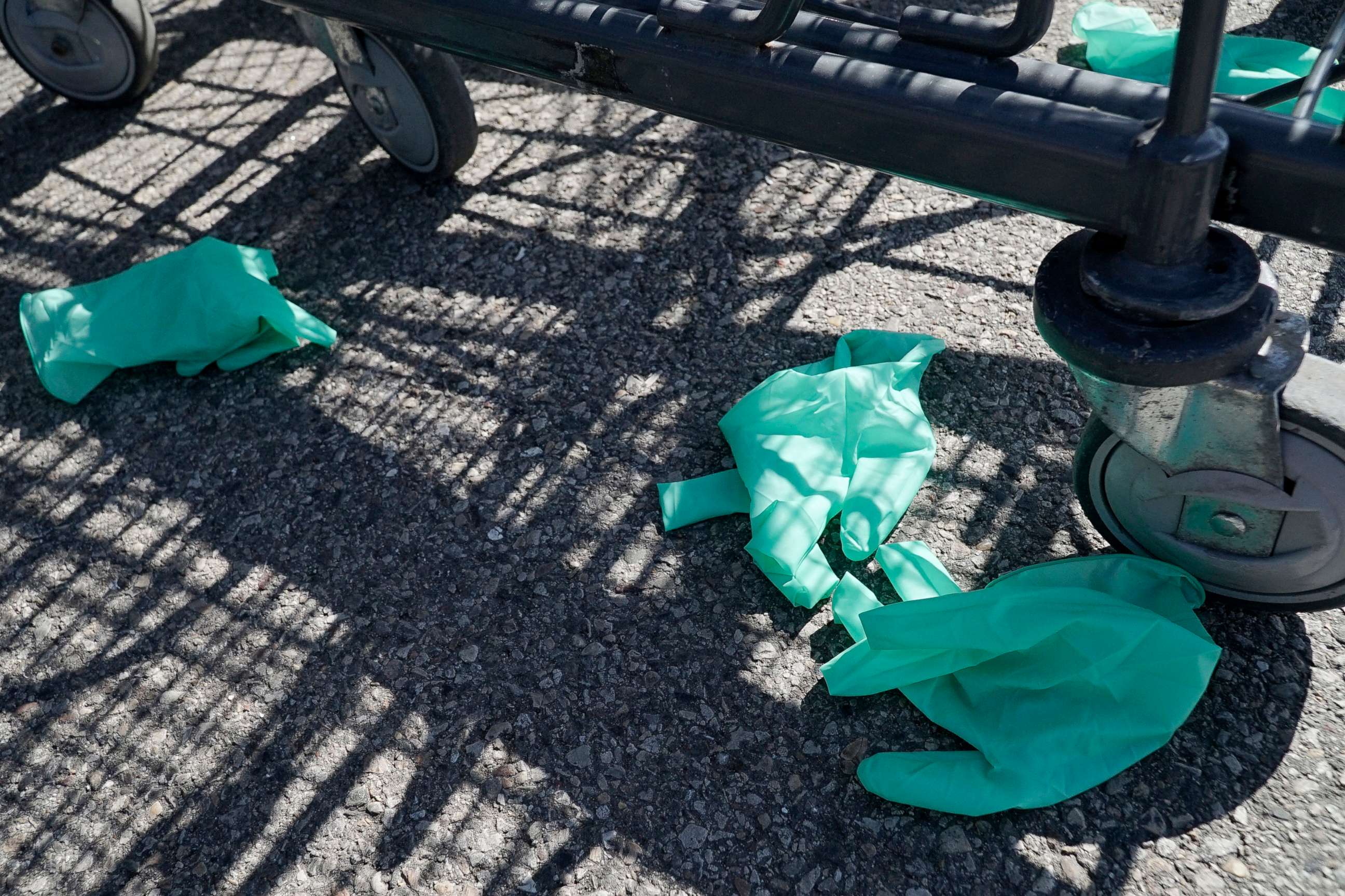 PHOTO:Discarded latex gloves lie on the ground outside of a grocery store in Glenview, Ill., April 5, 2020.