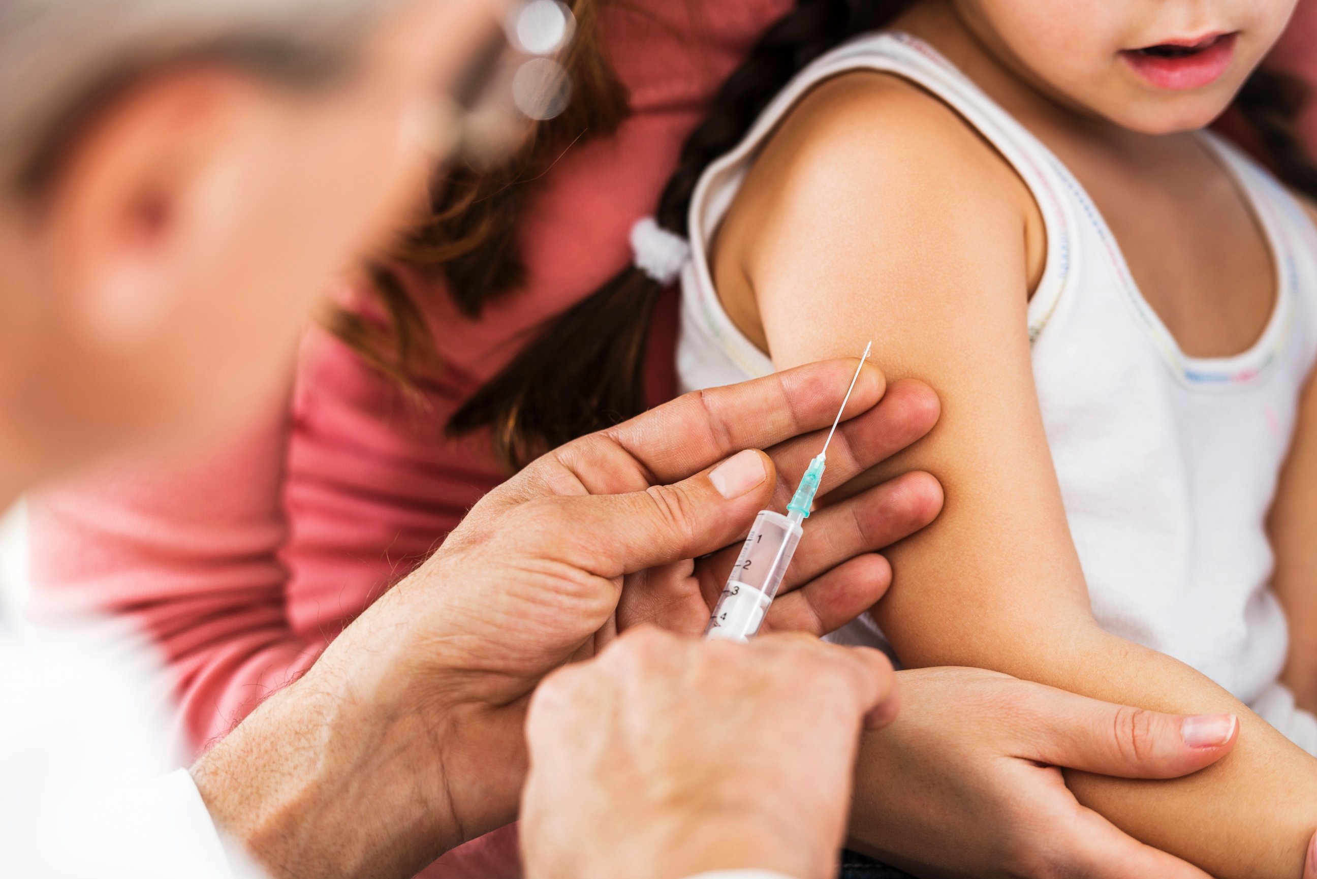 PHOTO: A child receives a flu shot in an undated stock photo. 