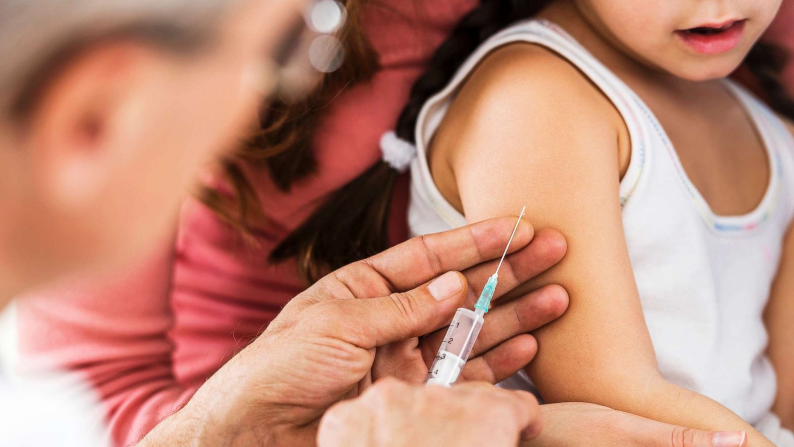 PHOTO: A child receives a flu shot in an undated stock photo.