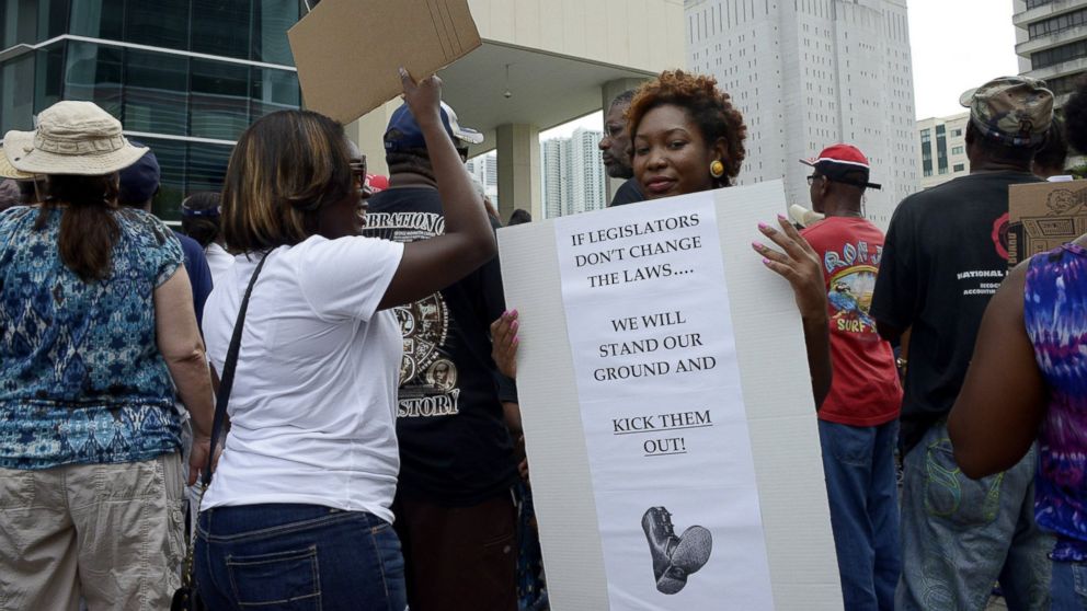 Monique Messer holds her sign, which she says sums up her feelings about Florida 'Stand Your Ground' laws, during a 'Justice for Trayvon' rally at the Wilkie D. Ferguson Federal Courthouse in Miami, Florida, July 20, 2013.