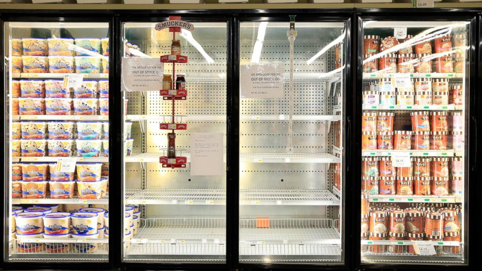 Shelves are bare and signs are posted where Blue Bell products were displayed in a grocery store on April 21, 2015 in Overland Park, Kan.