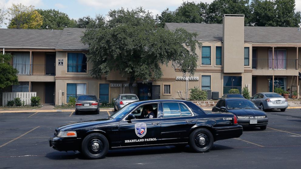 A private security guard patrols The Ivy Apartments where the confirmed Ebola virus patient was staying on Oct. 1, 2014 in Dallas.