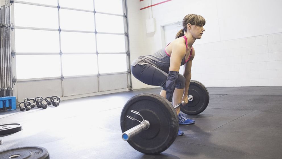 A woman practices deadlifts in an undated stock photo.