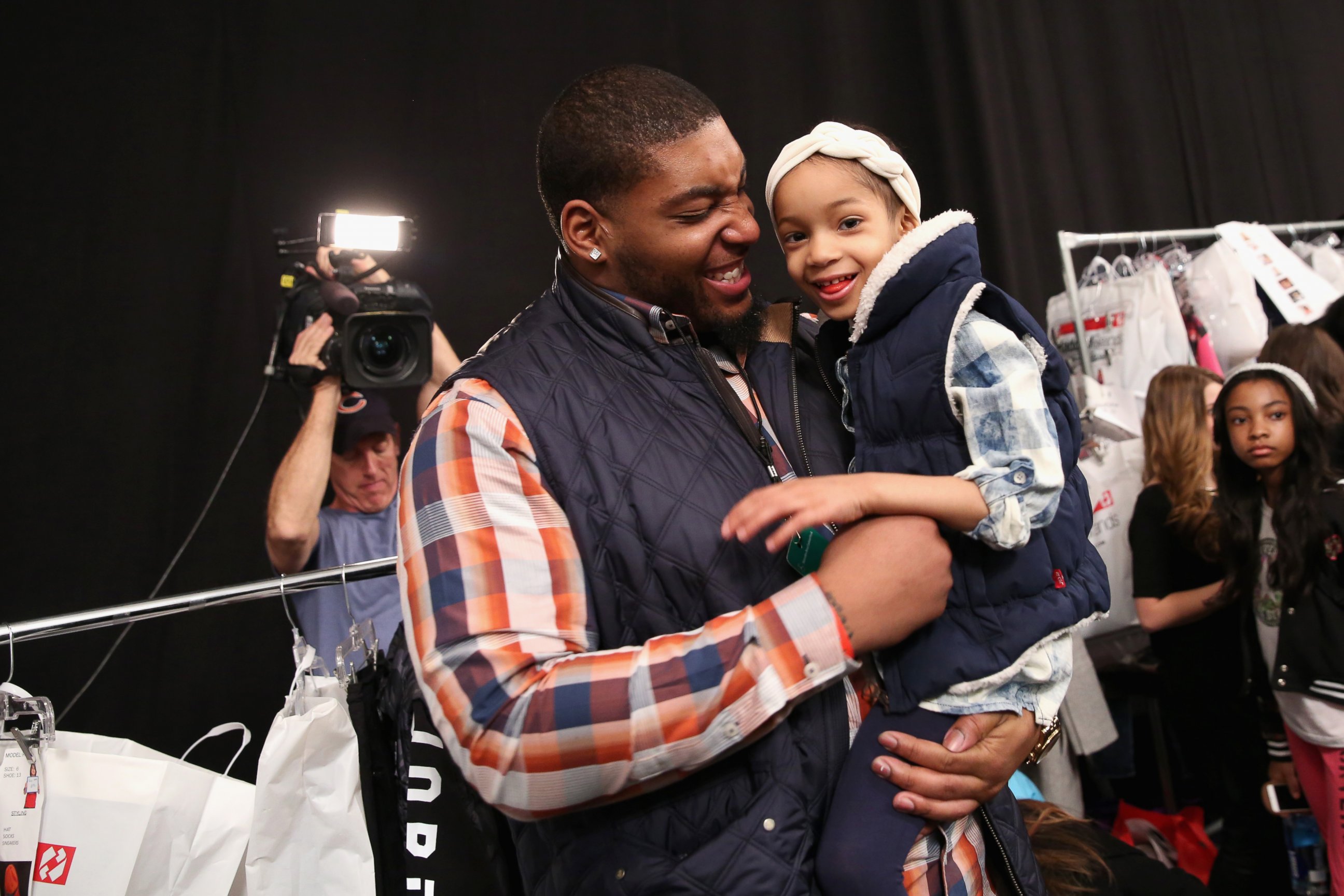 PHOTO: NFL player Devon Still and his daughter Leah attend the Nike Levi's Kids fashion show at The Salon at Lincoln Center on Feb. 12, 2015 in New York City.