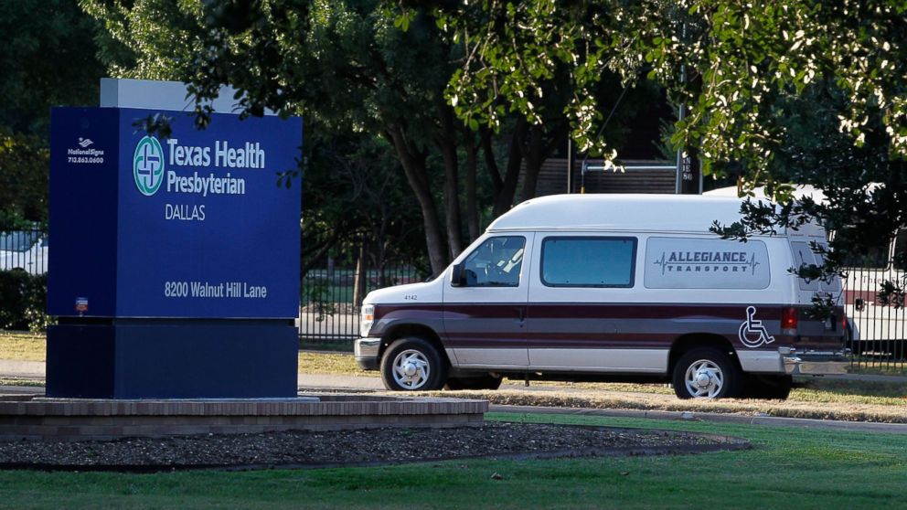PHOTO: A medical transport van moves past Texas Health Presbyterian Hospital Dallas where a patient has been diagnosed with the Ebola virus, Sept. 30, 2014 in Dallas, Texas.