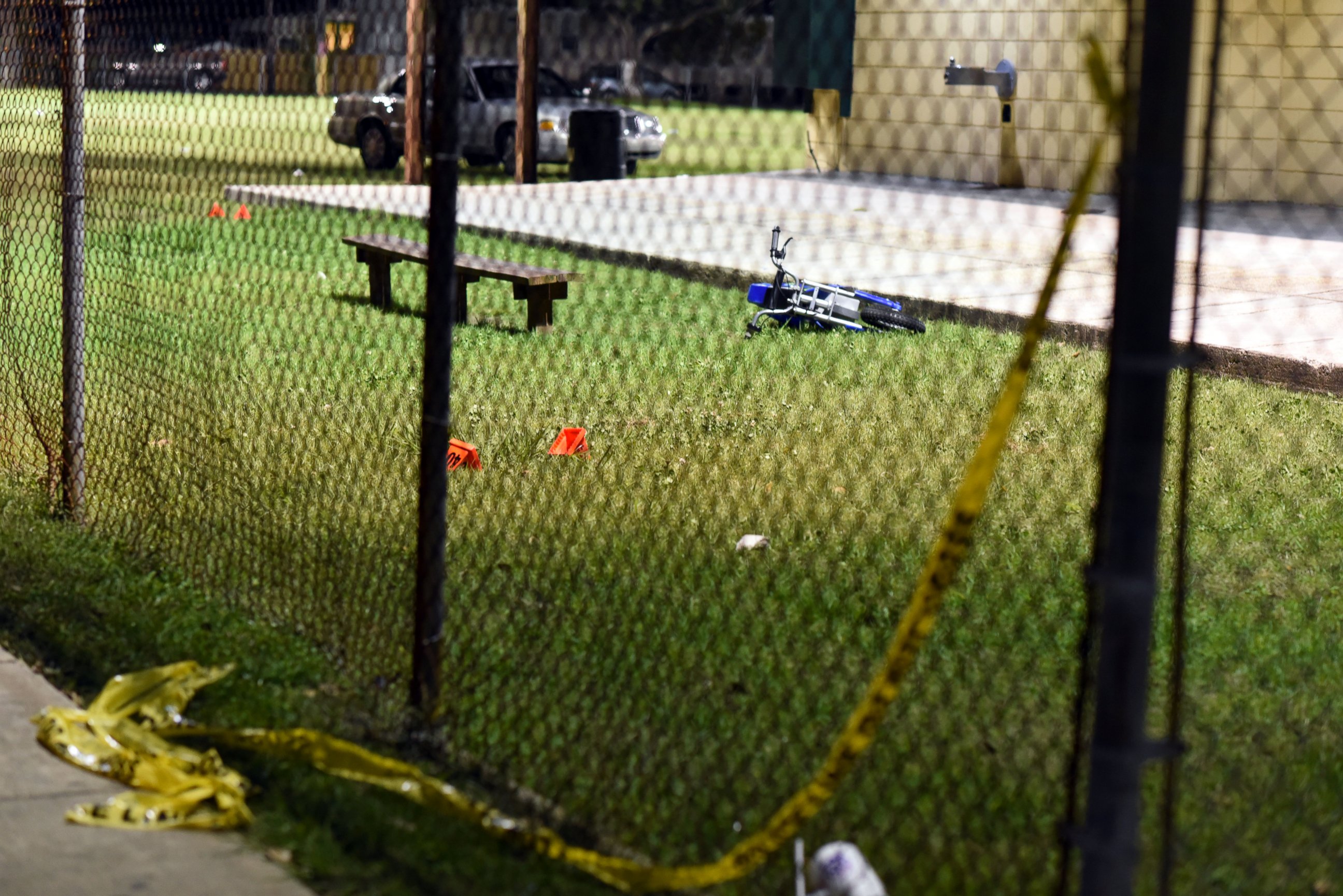 PHOTO: Evidence markers sit on the ground after a shooting at a playground on Nov. 22, 2015 in New Orleans.