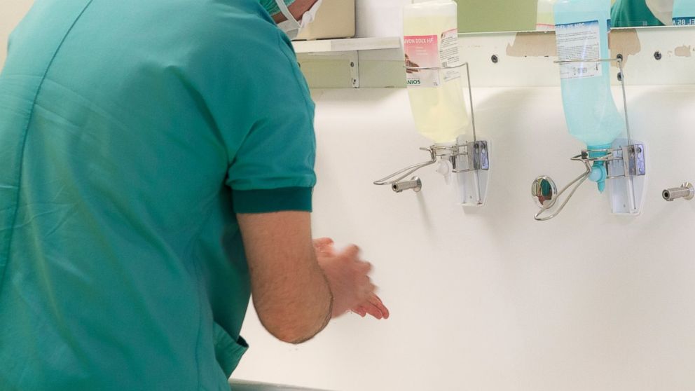 A surgeon washes his hands at hospital in Thonon, France in an undated stock photo.