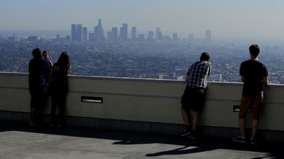 Visitors to Griffith park overlook a smoggy L.A. Basin in Los Angeles, Calif., Oct. 24, 2014.