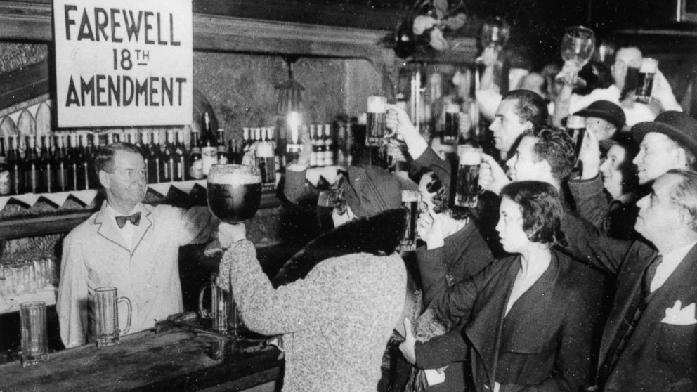 People of New York are celebrating the end of the Prohibition with beer, circa 1933.  
